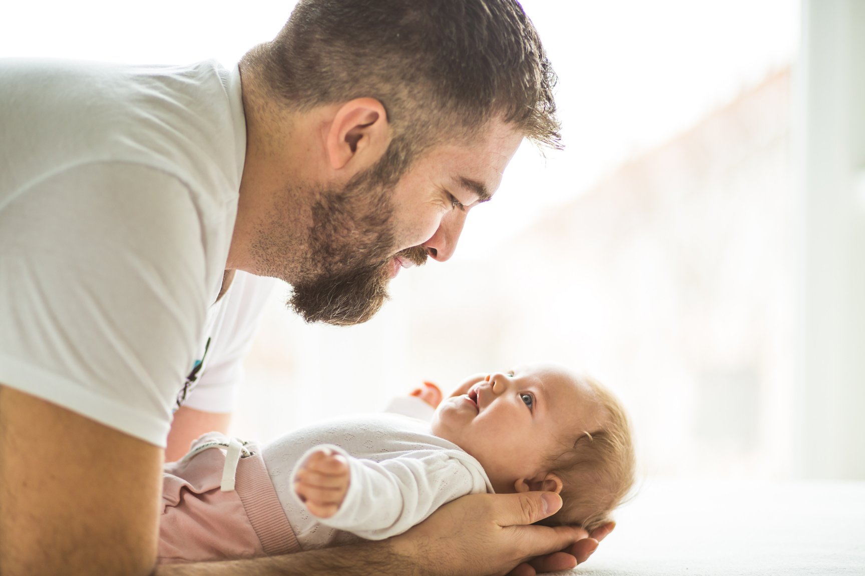 Father talking to his baby daughter